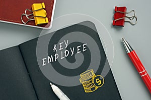 Business concept meaning KEY EMPLOYEE with phrase on the page. AÃÂ key employeeÃÂ is anÃÂ employeeÃÂ with major ownership and/or photo